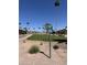 Scenic view of the lush golf course, featuring mature trees and clear signage for golfers at 5808 E Lockwood St, Mesa, AZ 85215