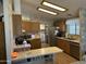 Well-equipped kitchen features wood cabinets, modern appliances, and breakfast bar at 5808 E Lockwood St, Mesa, AZ 85215