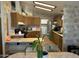Open kitchen features wood cabinets, stainless steel appliances, and breakfast bar at 5808 E Lockwood St, Mesa, AZ 85215