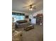 Cozy living room with a ceiling fan, and a large window at 5808 E Lockwood St, Mesa, AZ 85215