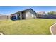 Lush green backyard providing ample space for entertainment and outdoor activities at 6319 W Hilton Ave, Phoenix, AZ 85043