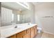 Bathroom featuring double sink vanity and shower, offering ample space and functionality at 6319 W Hilton Ave, Phoenix, AZ 85043