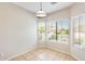 Bright dining area with tile floors and ample sunlight streaming through multiple windows at 6319 W Hilton Ave, Phoenix, AZ 85043