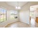 Dining room with tile flooring and two large windows at 6319 W Hilton Ave, Phoenix, AZ 85043