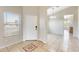 Tiled entry features a front door, window and chandelier at 6319 W Hilton Ave, Phoenix, AZ 85043