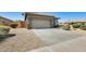 Single-story home with two-car garage and concrete driveway at 6319 W Hilton Ave, Phoenix, AZ 85043