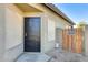Side exterior of house with security door and privacy gate at 6319 W Hilton Ave, Phoenix, AZ 85043
