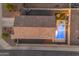 Aerial view of a home showcasing a beautiful backyard with a sparkling pool and an inviting outdoor seating area at 7145 E Eagle Nest Way, San Tan Valley, AZ 85143