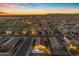 Wide aerial shot showcasing the neighborhood at sunset, highlighting the pool at 7145 E Eagle Nest Way, San Tan Valley, AZ 85143