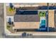 Backyard aerial view featuring a pristine pool, putting green, and spacious patio area at 7145 E Eagle Nest Way, San Tan Valley, AZ 85143