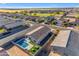 Aerial view of backyard oasis with pool, landscaping, and putting green at 7145 E Eagle Nest Way, San Tan Valley, AZ 85143