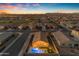 Beautiful aerial dusk view featuring the pool and backyard with lovely neighborhood views at 7145 E Eagle Nest Way, San Tan Valley, AZ 85143