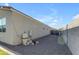 Image of the side of a home showing gravel landscaping and necessary equipment for pool maintenance at 7145 E Eagle Nest Way, San Tan Valley, AZ 85143