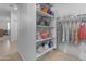 Organized walk-in closet featuring ample shelving and hanging space for clothes and accessories at 7145 E Eagle Nest Way, San Tan Valley, AZ 85143