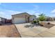 Well-maintained single-story home with a two-car garage, desert landscaping, and a neatly paved driveway at 7145 E Eagle Nest Way, San Tan Valley, AZ 85143
