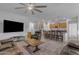 Spacious living room featuring an open floor plan, modern furniture, and seamless connection to the kitchen at 7145 E Eagle Nest Way, San Tan Valley, AZ 85143