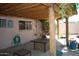 Relaxing covered patio with a wood beam ceiling and outdoor seating area at 717 E State Ave, Phoenix, AZ 85020