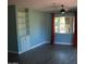 Bright bedroom with built-in shelving, a ceiling fan, hardwood floors, and a sunlit window at 717 E State Ave, Phoenix, AZ 85020