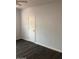 This bedroom features dark wood floors and a ceiling fan for added comfort at 717 E State Ave, Phoenix, AZ 85020