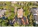 Aerial view of a well-maintained home with lush surroundings, a detached garage, and mature trees at 7252 N Central Ave, Phoenix, AZ 85020