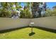 Backyard view featuring lush green grass, mature trees, and a vintage-style mailbox at 7252 N Central Ave, Phoenix, AZ 85020