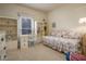 Cozy bedroom with a daybed, ample natural light, and built-in shelving to showcase decor at 7252 N Central Ave, Phoenix, AZ 85020