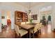 Well-lit dining area with wood table and chairs, featuring an open doorway and built-in bookcase at 7252 N Central Ave, Phoenix, AZ 85020