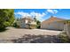 Charming home featuring a well-manicured yard and a detached garage with matching architectural details at 7252 N Central Ave, Phoenix, AZ 85020