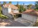 Charming home with a balcony, well-manicured lawn, flowers, and detached garage at 7252 N Central Ave, Phoenix, AZ 85020