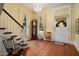 Elegant foyer featuring hardwood floors, staircase, and charming decorative accents at 7252 N Central Ave, Phoenix, AZ 85020