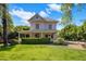 Charming two-story home with manicured lawn, inviting porch, and lush greenery at 7252 N Central Ave, Phoenix, AZ 85020