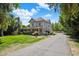 A charming home featuring a welcoming porch and a long driveway leading to the property at 7252 N Central Ave, Phoenix, AZ 85020