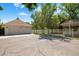 Garage boasts a gazebo, concrete driveway, and a secure fence for privacy and security at 7252 N Central Ave, Phoenix, AZ 85020