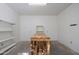 Bright and airy garage with shelving and a wooden workbench offering a perfect space for projects at 7252 N Central Ave, Phoenix, AZ 85020