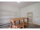 Bright and airy garage with shelving and a wooden workbench offering a perfect space for projects at 7252 N Central Ave, Phoenix, AZ 85020