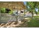 Charming gazebo with hanging flower baskets and a view of the lush, landscaped backyard at 7252 N Central Ave, Phoenix, AZ 85020