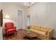 Cozy living room with hardwood floors, a bright sofa, and a traditional-style interior at 7252 N Central Ave, Phoenix, AZ 85020