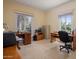 A home office featuring two desks, natural lighting and neutral walls at 7252 N Central Ave, Phoenix, AZ 85020
