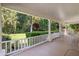 Cozy porch with white railing and chairs provides a perfect spot for relaxation at 7252 N Central Ave, Phoenix, AZ 85020