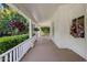 Comfortable front porch features chairs, hanging plants, and ample space for relaxing at 7252 N Central Ave, Phoenix, AZ 85020