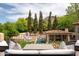Beautiful backyard view from the covered patio showcasing a pool and outdoor kitchen at 7525 N Shadow Mountain Rd, Paradise Valley, AZ 85253