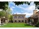 Expansive backyard featuring a stone home, lush lawn, and inviting outdoor spaces with beautiful mountain views at 7525 N Shadow Mountain Rd, Paradise Valley, AZ 85253