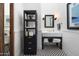 Elegant bathroom with black and white tile, a stylish vanity, and a well-organized storage unit at 7525 N Shadow Mountain Rd, Paradise Valley, AZ 85253