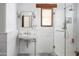 Elegant bathroom featuring a walk-in shower, stylish sink, and marble countertops at 7525 N Shadow Mountain Rd, Paradise Valley, AZ 85253