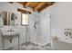 Bright bathroom with a walk-in shower, standalone tub, and vintage style fixtures, creating a luxurious spa experience at 7525 N Shadow Mountain Rd, Paradise Valley, AZ 85253