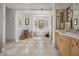 Spacious bathroom featuring dual vanities, standalone tub and checkered tile floors, creating a serene atmosphere at 7525 N Shadow Mountain Rd, Paradise Valley, AZ 85253