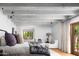 Bright bedroom boasts white wood beam ceiling and cozy sitting area at 7525 N Shadow Mountain Rd, Paradise Valley, AZ 85253