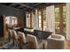 Elegant dining room with seating for ten and views of a beautiful garden at 7525 N Shadow Mountain Rd, Paradise Valley, AZ 85253