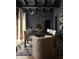 Elegant dining room with stylish lighting, black walls, and views to exterior at 7525 N Shadow Mountain Rd, Paradise Valley, AZ 85253