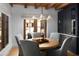 Cozy dining room features wood floors, a round table, and views to the patio at 7525 N Shadow Mountain Rd, Paradise Valley, AZ 85253